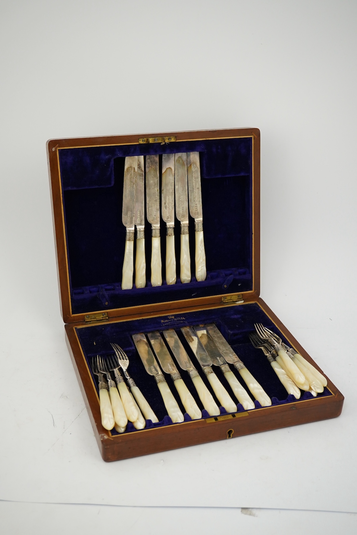 Twelve pairs of Victorian mother of pearl handled silver dessert eaters, by Mappin & Webb